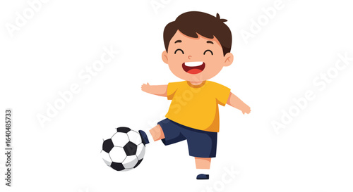 A happy young boy in a yellow shirt and blue shorts is playing with a soccer ball, smiling widely.