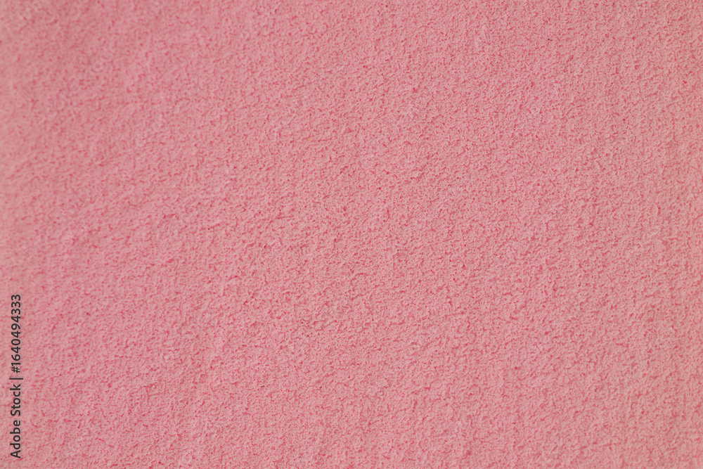Fototapeta premium Textured Surface in Soft Pink Shade Creates a Calming Backdrop for Artistic Projects and Interior Design