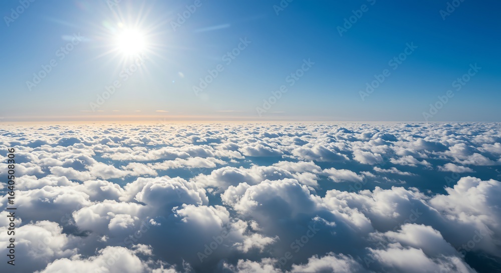Fototapeta premium Bright Sun Over Cloudscape in Clear Blue Sky Above White Fluffy Clouds