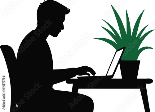 Silhouette of Man Working on Laptop