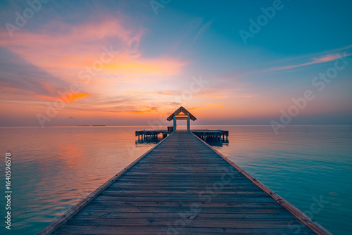 Fototapeta Naklejka Na Ścianę i Meble -  Picturesque summer Maldives sunset landscape tropical paradise beach relaxing sea lagoon vacation destination wooden pier over dream seascape horizon. Exotic resort island luxury travel scenic