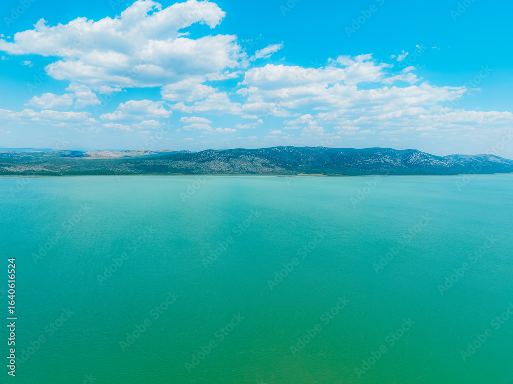 Obraz premium Shore of Vrana lake or Vransko jezero in Dalmatia near Zadar in Croatia. Ornithological nature park.