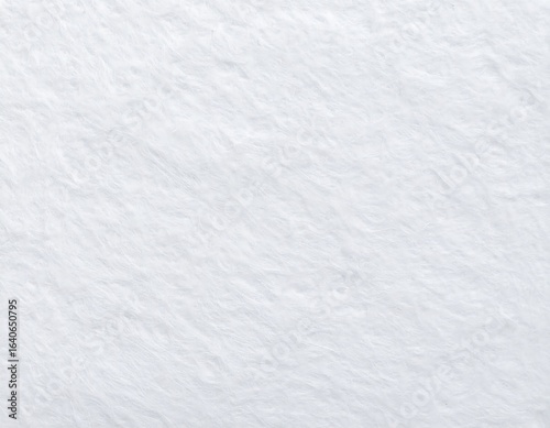 Close-up view of a soft, white faux fur fabric