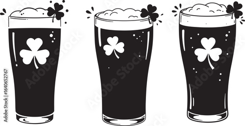 Three glasses of dark beer with shamrock decorations silhouette