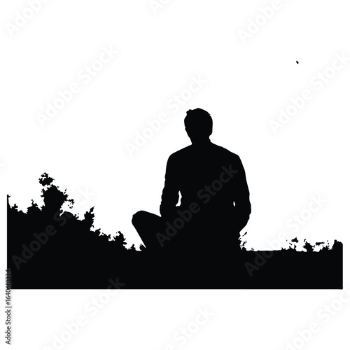 silhouette of a man sitting in the park