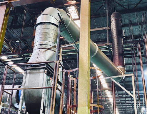 фотографія Large industrial duct and plenum system inside a manufacturing plant, designed for efficient air and fluid transport in heavy-duty factory operations and production environments