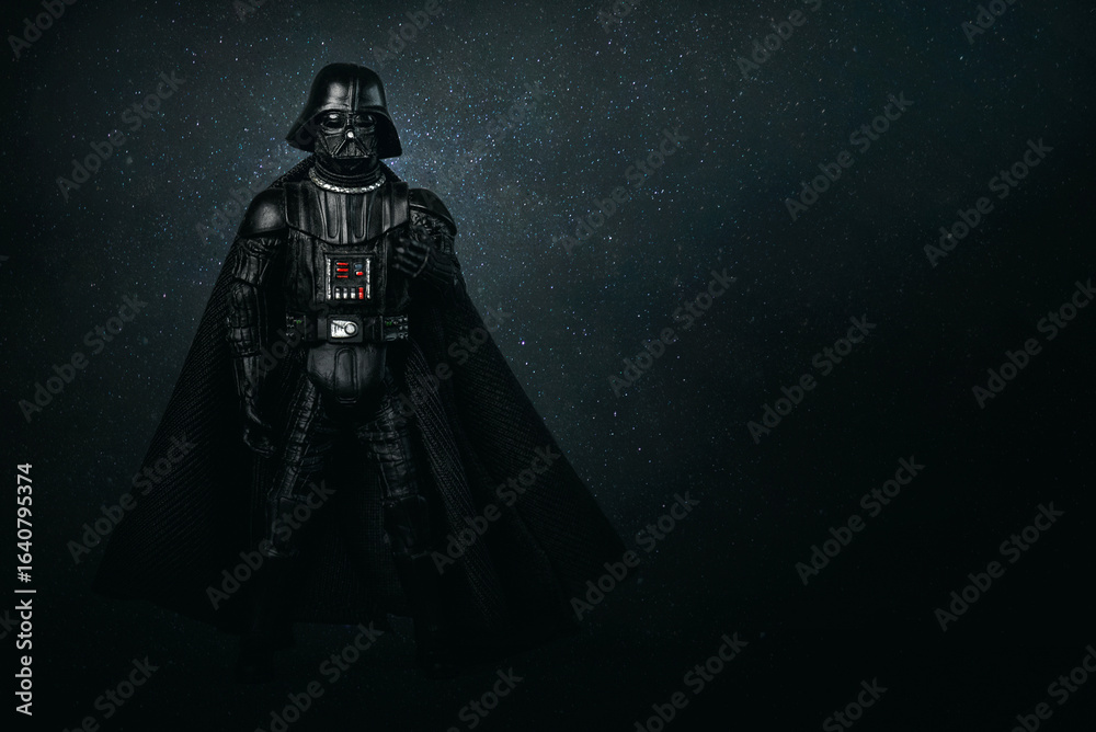 Fototapeta premium Darth Vader action figure character from the Star Wars movie saga and space for text. Illustrative editorial