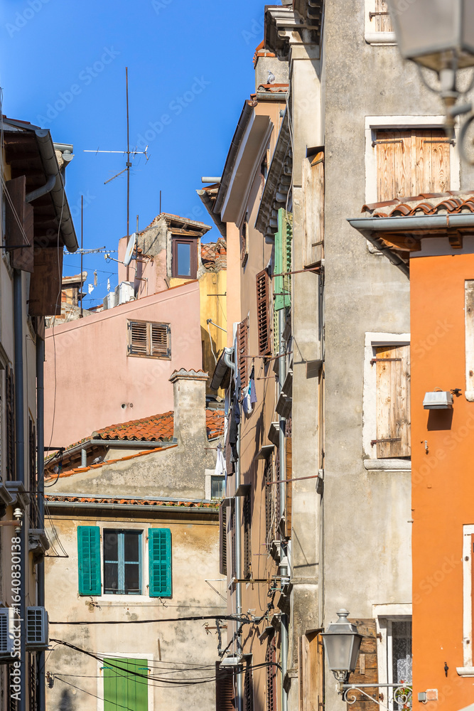 Fototapeta premium Rovinj, Croatia street with traditional buildings in historic old town