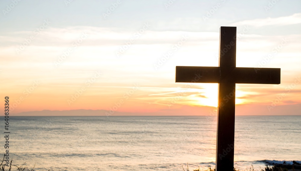 Silhouette of a cross against a sunset over a calm ocean Silhouette of a cross against a sunset over a calm ocean