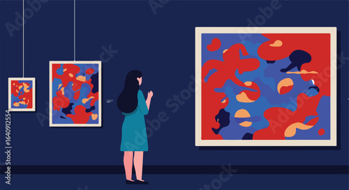 Figure looking at colorful abstract paintings in an art gallery on a blue wall