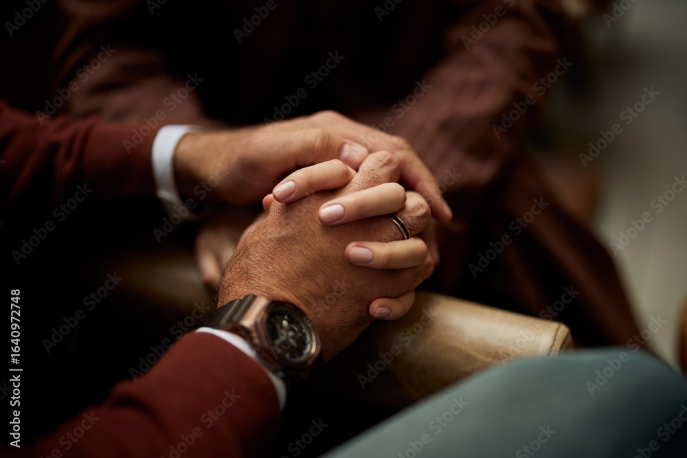 Fototapeta premium Close-Up of Hands Holding Each Other in a Moment of Comfort and Care