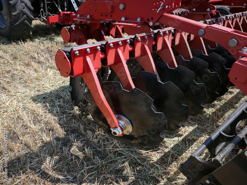 Close-up of a large modern plow or disc harrow for cultivating the land.