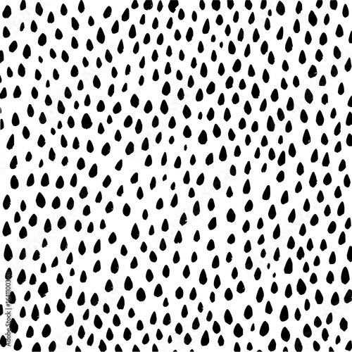 Minimalist black drops on white background forming a dense pattern, scattered and unevenly distributed across the surface vector