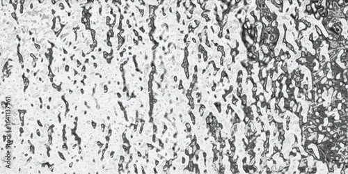 Abstract monochrome texture with organic patterns evoking the appearance of a surface depicting natural growth and fluidity