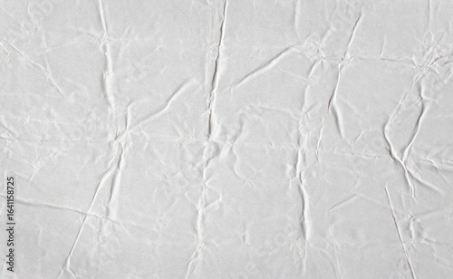 Фотография White creased crumpled glued paper poster mockup texture background