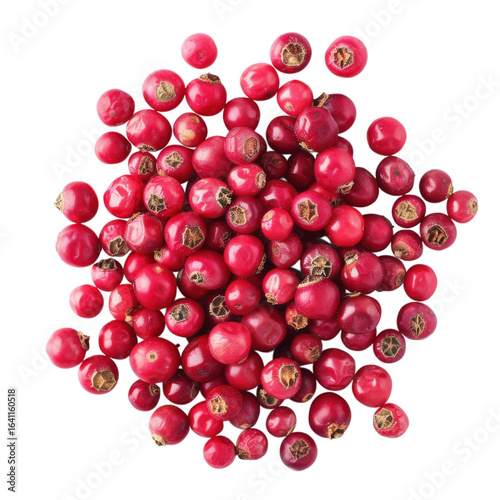 A top view of a pile of vibrant pink peppercorns on black background
