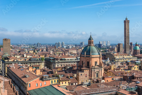 Panorama of historic part of Bologna city, Italy - view from St Petronius Basilica with dome of Santa Maria della Vita church and Two Towers
