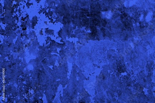 Close-up view of a blue textured wall showing rough patterns and intricate shadow details, offering a visually appealing background texture for versatile creative uses.