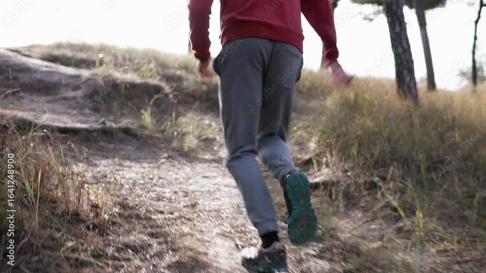 Athletic man running in nature. Concept of willpower and motivation, achieving goals. Athletic man running in nature. Concept of willpower and motivation, achieving goals.