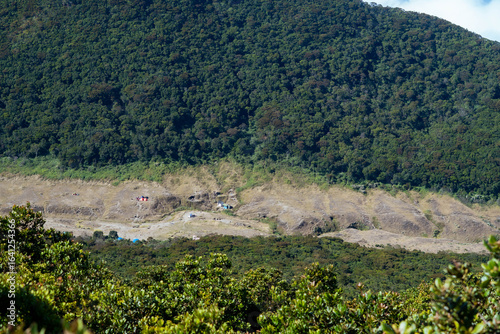 Deforested valley in tropical mountains, illustrating environmental impact and land use change