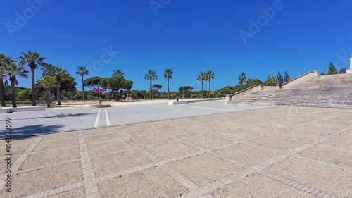 Spain. Huelva, Deserted square near the monastery with a high obelisk