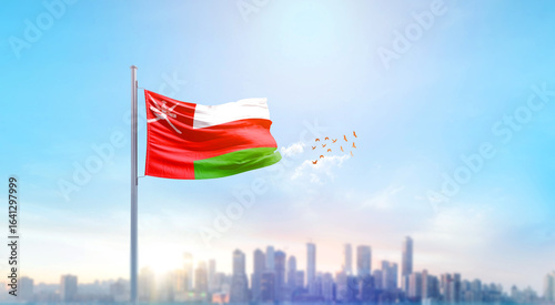 Oman national flag waving with skyline and buildings. Oman national flag for independence day.