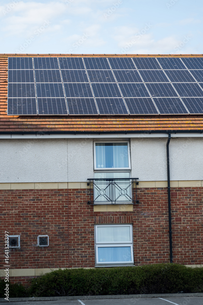 Fototapeta premium solar panels on the roof, sun energy system. Green energy