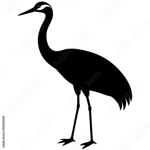 Elegant black silhouette of a crane standing tall