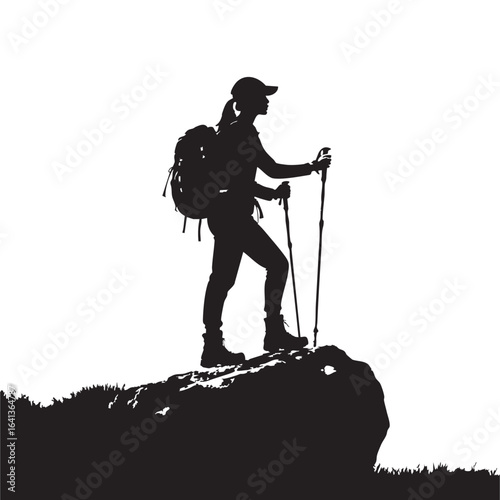 Silhouette of Female Hiker on Mountaintop with Backpack and Trekking Poles