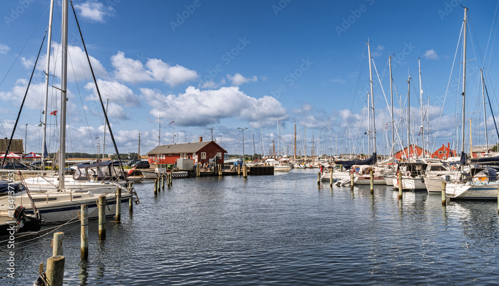 Obraz premium Scenic Marina with Boats Docked Under a Clear Blue Sky on a Sunny Day, Faaborg, Denmark