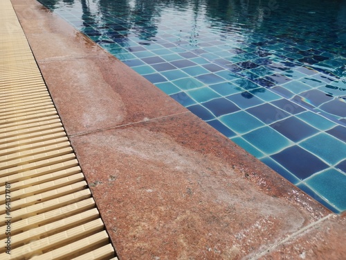 swimming pool in the hotel. Dried chlorine stains on marble surfaces near the swimming pool.