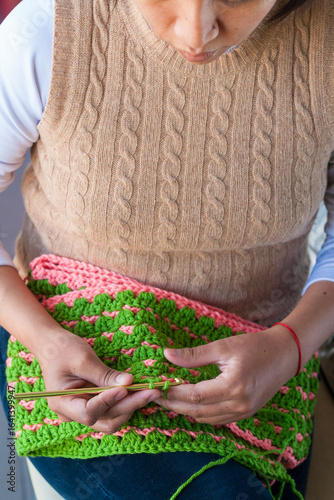 Young Latina woman crocheting