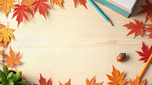 Autumn classroom decorations with colorful leaves and wooden desk  