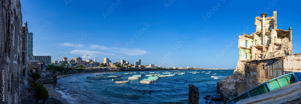 Fototapeta premium Mogadishu harbor, with its crumbling Italian colonial era architecture, a tentative world heritage site. Mogadishu is the capital of Somalia