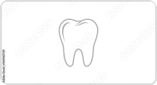 Clean white tooth on a white background, dental health concept