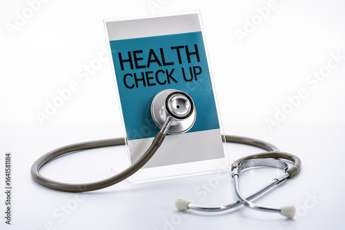 Stethoscope rests against sign that reads Health Check Up, symbolizing medical examination and healthcare. image conveys sense of professionalism and care