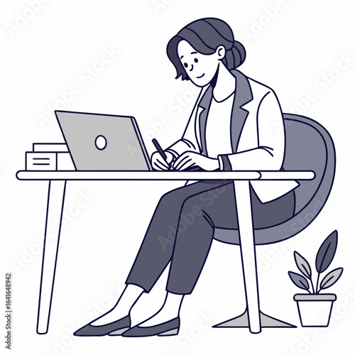 A smiling woman in business attire sits at a desk working on a laptop and taking notes