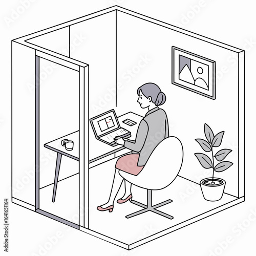 Woman working on a laptop in a modern office cubicle with a plant and framed artwork