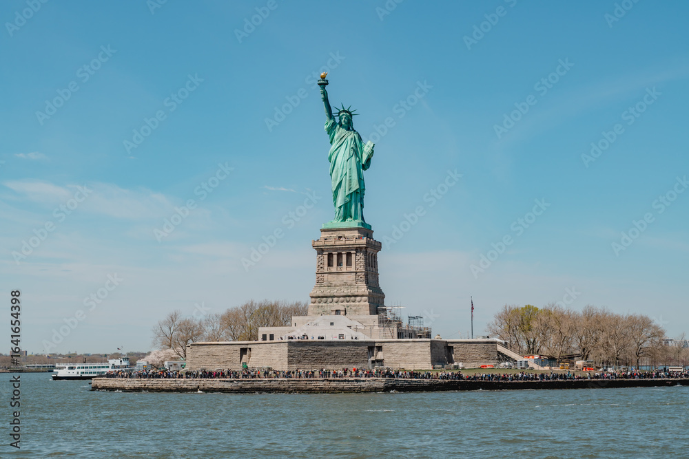 Fototapeta premium Statue of Liberty at Manhattan in New York United States. Sunny Day Manhattan United States. Liberty State Park. Downtown New York City.