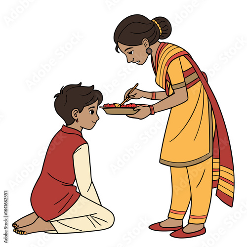 A sister lovingly feeds her younger brother a sweet treat from a plate during a cultural celebration