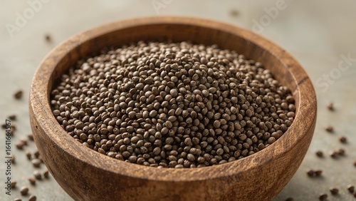 A bowl of raw chia seeds ri...