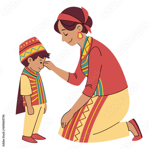 Mother gently touches forehead of son wearing traditional clothing and headdress in a loving gesture