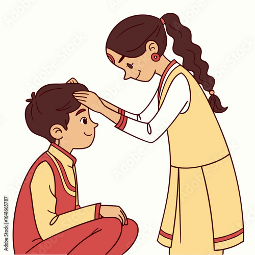 Young indian sister places a blessing on her brother s forehead during a traditional ceremony