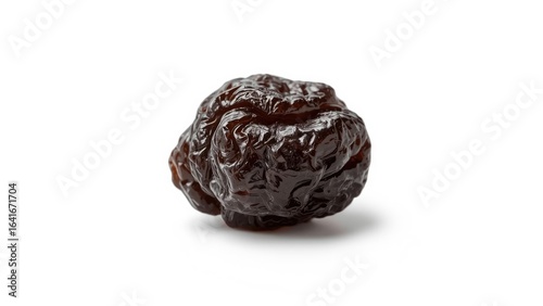 Isolated dried grape on a w...