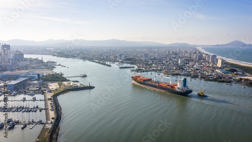 Aerial view of a cargo ship entering the Itajaí-Açu River between Itajaí and Navegantes, Brazil.
