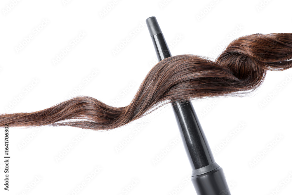 Naklejka premium Curling iron with brown hair lock isolated on white