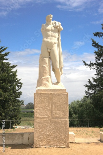 Sculpture of a Roman man in the Roman city of Italica near Seville