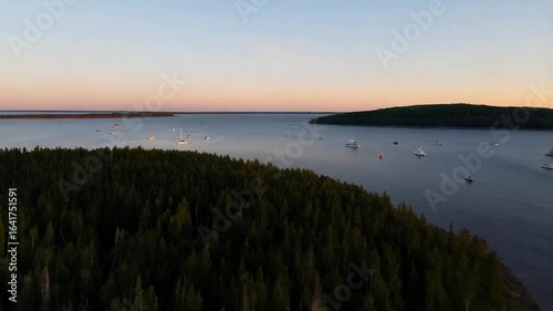 Sunset Serenity: Aerial View of Boats Anchored near Islands