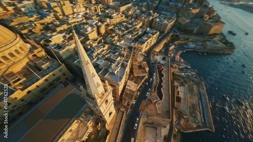 Church and dome. Valletta, capital of Malta island. Sunset city. FPV drone view
