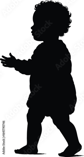 Silhouette of a Baby Taking First Steps